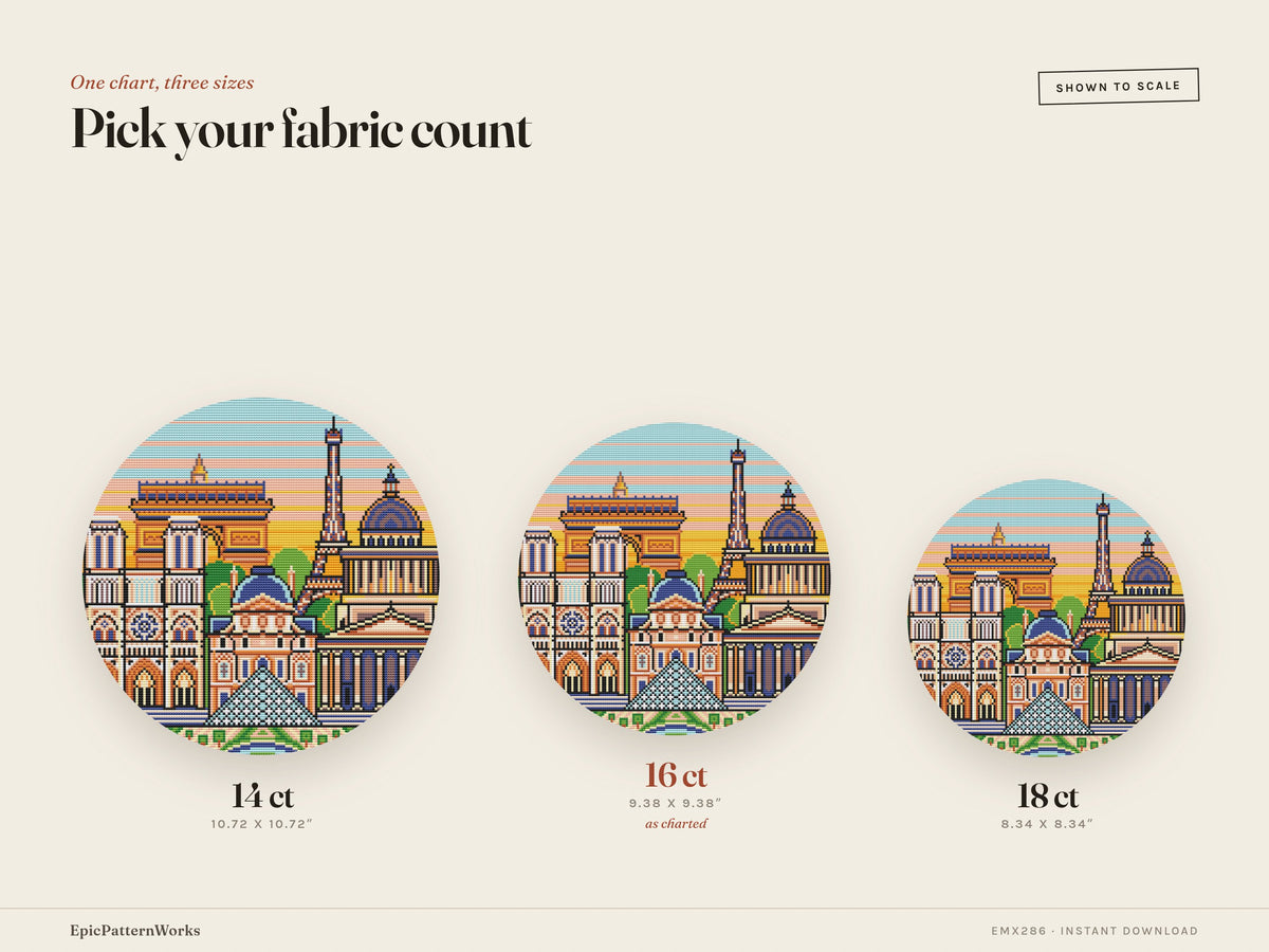 Round Paris cityscape cross stitch pattern showing the Eiffel Tower, Arc de Triomphe, Notre Dame, Louvre pyramid and domed buildings against a striped sunset sky.